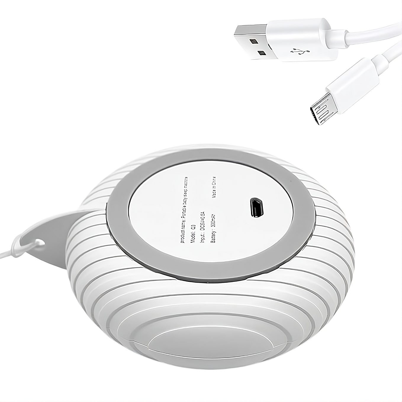 Bottom view of baby white noise machine showing USB charging port and cable