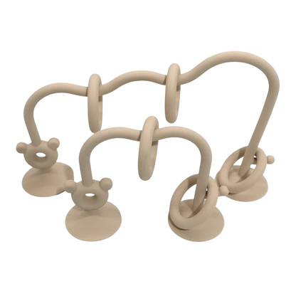 Beige silicone bead maze toy with sliding rings designed for baby sensory play.
