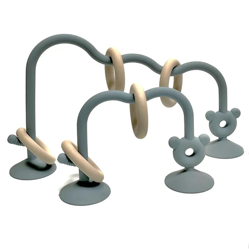 Blue silicone bead maze toy for babies featuring suction cups and movable rings.