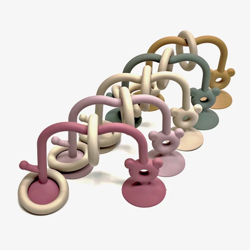Silicone bead maze toys for babies available in multiple soft colors.