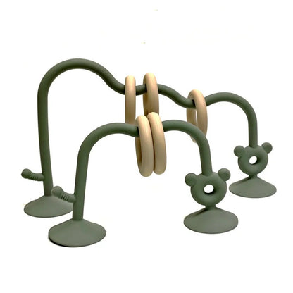 Silicone baby bead maze toy in green for fine motor skill development.