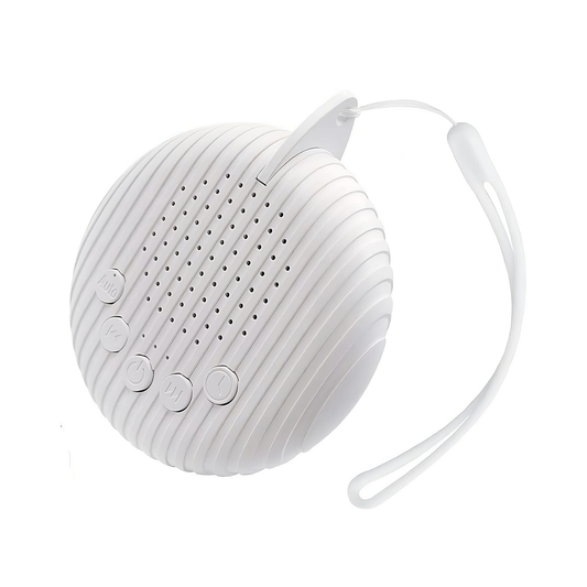 Close-up of portable white noise machine with control buttons and speaker design