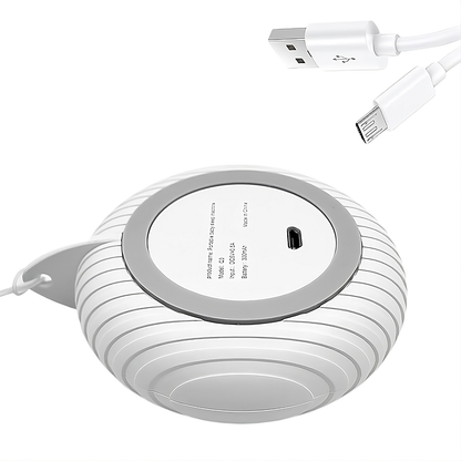 Bottom view of baby white noise machine showing USB charging port and cable