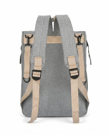 Grey baby nappy bag backpack back view showing padded adjustable shoulder straps and beige hardware