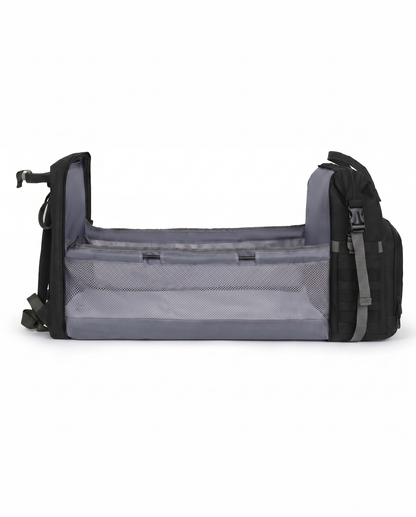 Black foldable baby nappy bag backpack converted into portable travel bassinet cot with mesh sides 