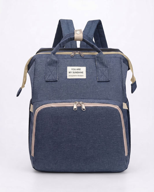 Navy blue foldable baby nappy bag backpack with beige trim and dual carry handles