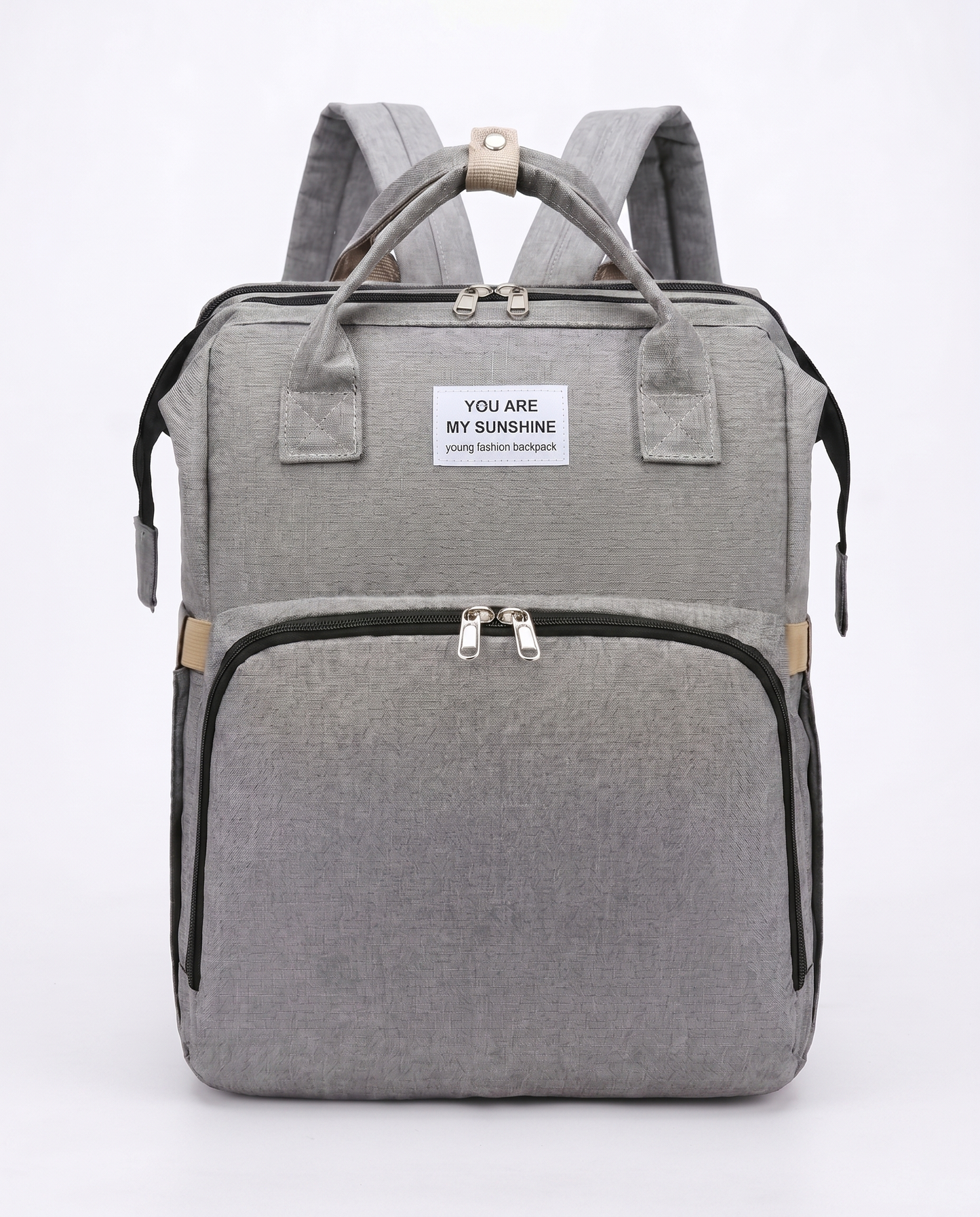 Grey foldable baby diaper backpack with carry handles, large front pocket and beige zip detail