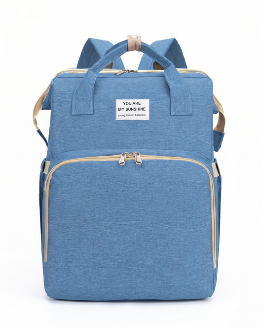 Sky blue foldable nappy bag backpack with beige trim and multiple zip compartments for new parents