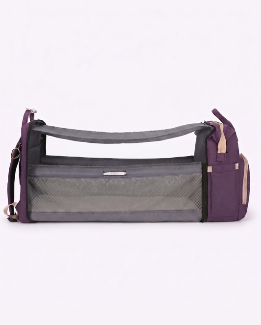 Purple baby diaper backpack unfolded into portable travel bassinet cot