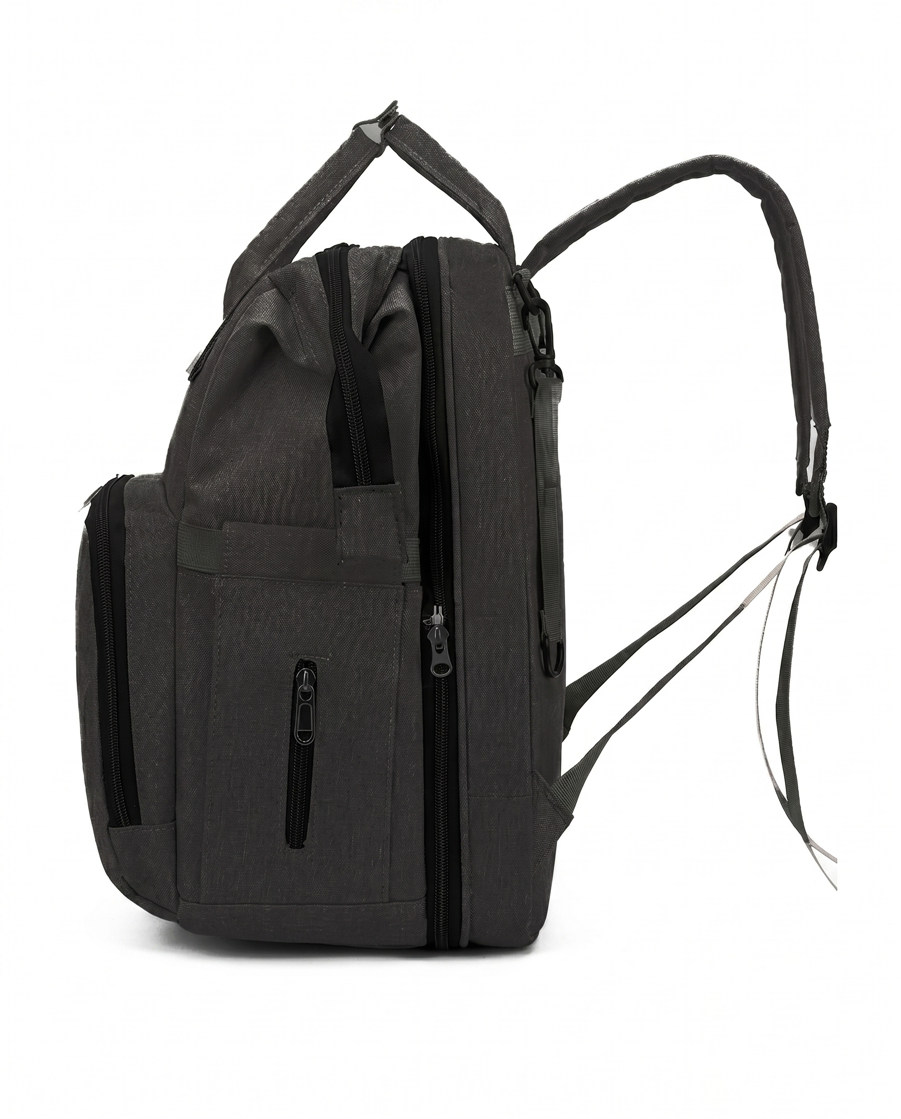 Black baby diaper bag backpack side view showing multiple zip pockets and padded shoulder strap