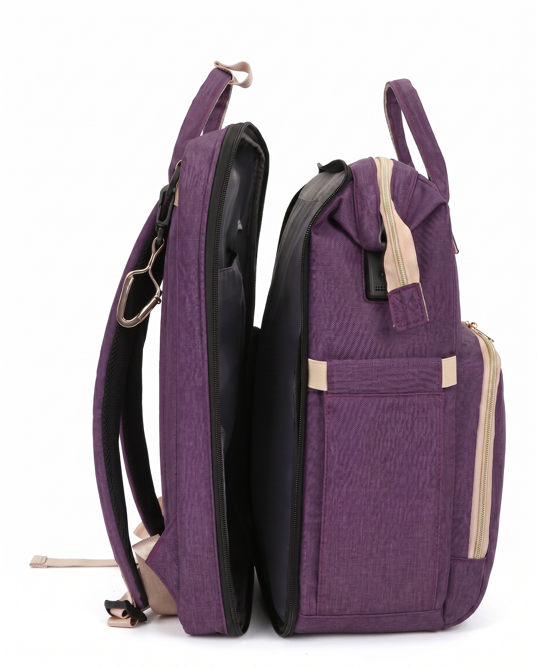 Purple foldable baby bag backpack open showing spacious interior compartment and stroller strap