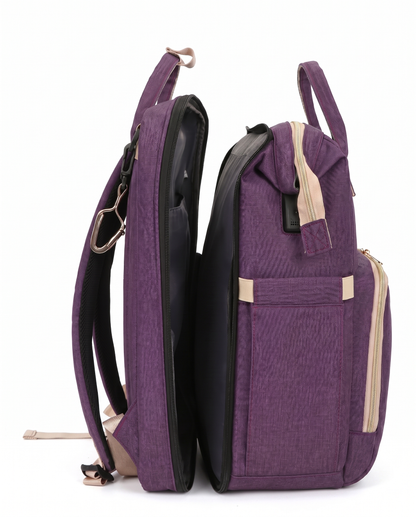 Purple foldable baby bag backpack open showing spacious interior compartment and stroller strap