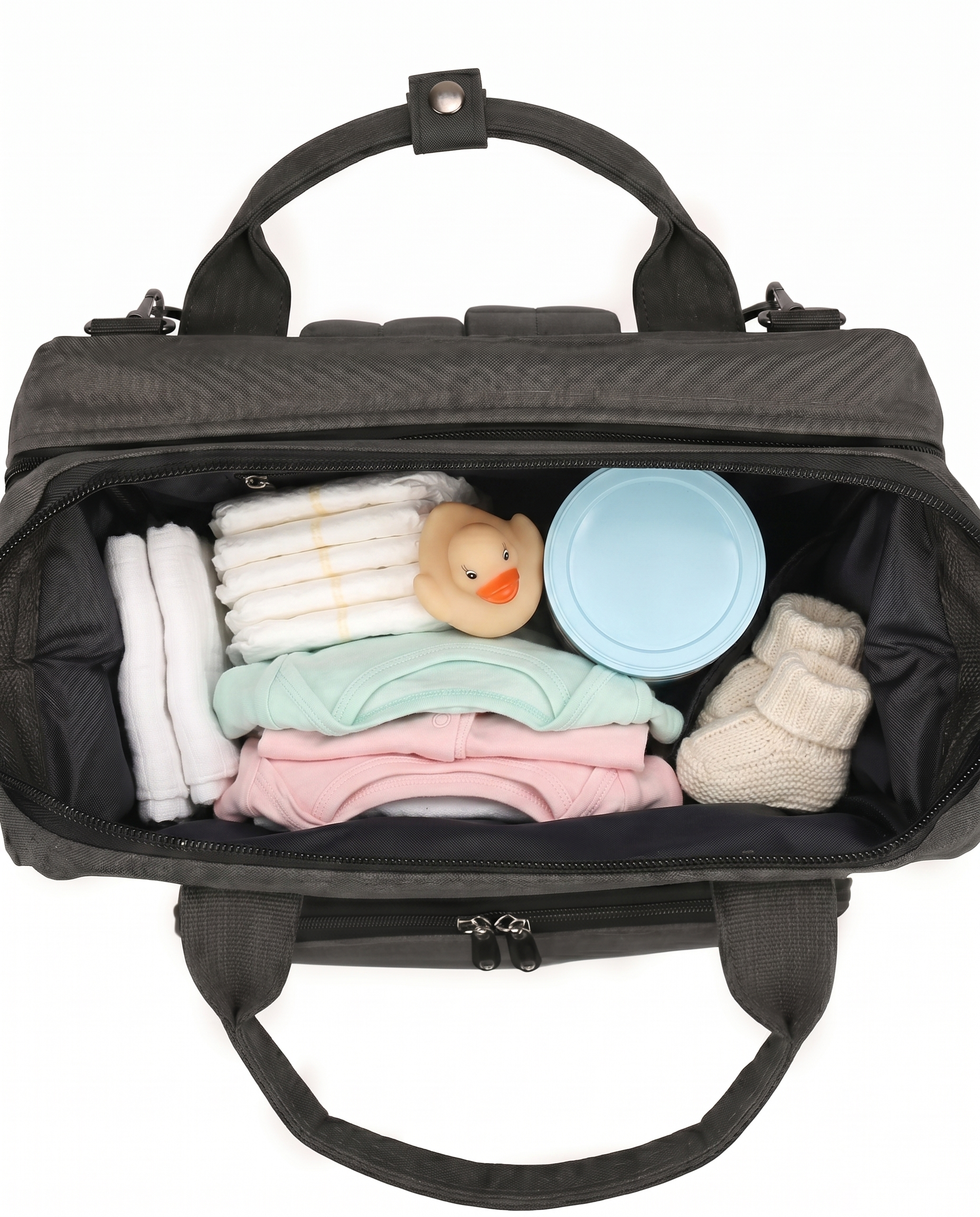 Black baby diaper bag backpack open top view packed with nappies, baby clothes and toys