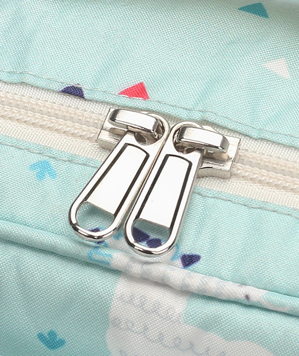 Close-up of smooth double zip pull on mint green alpaca print nappy bag